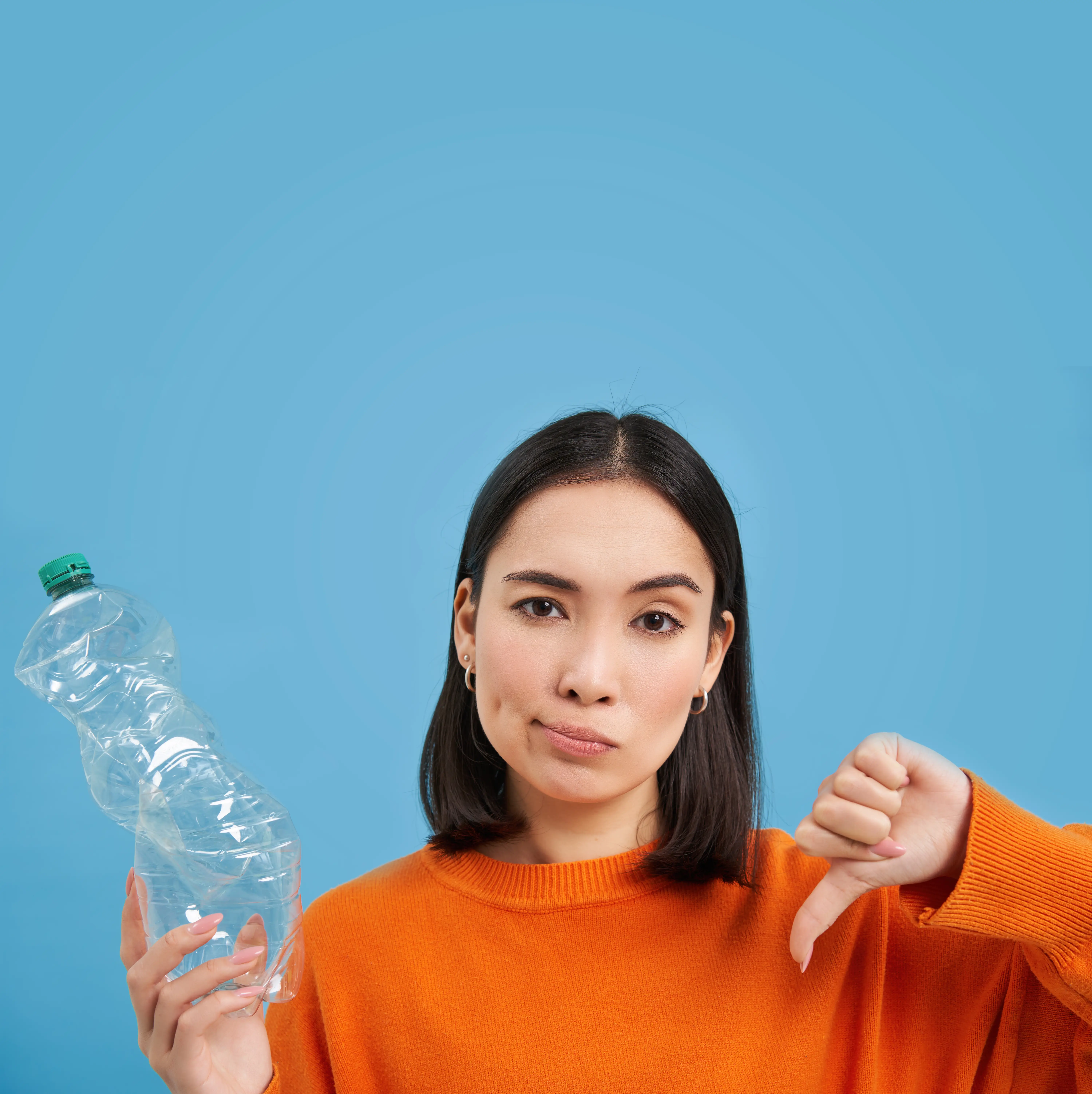 Girl dissapproving the use of plastic bottles